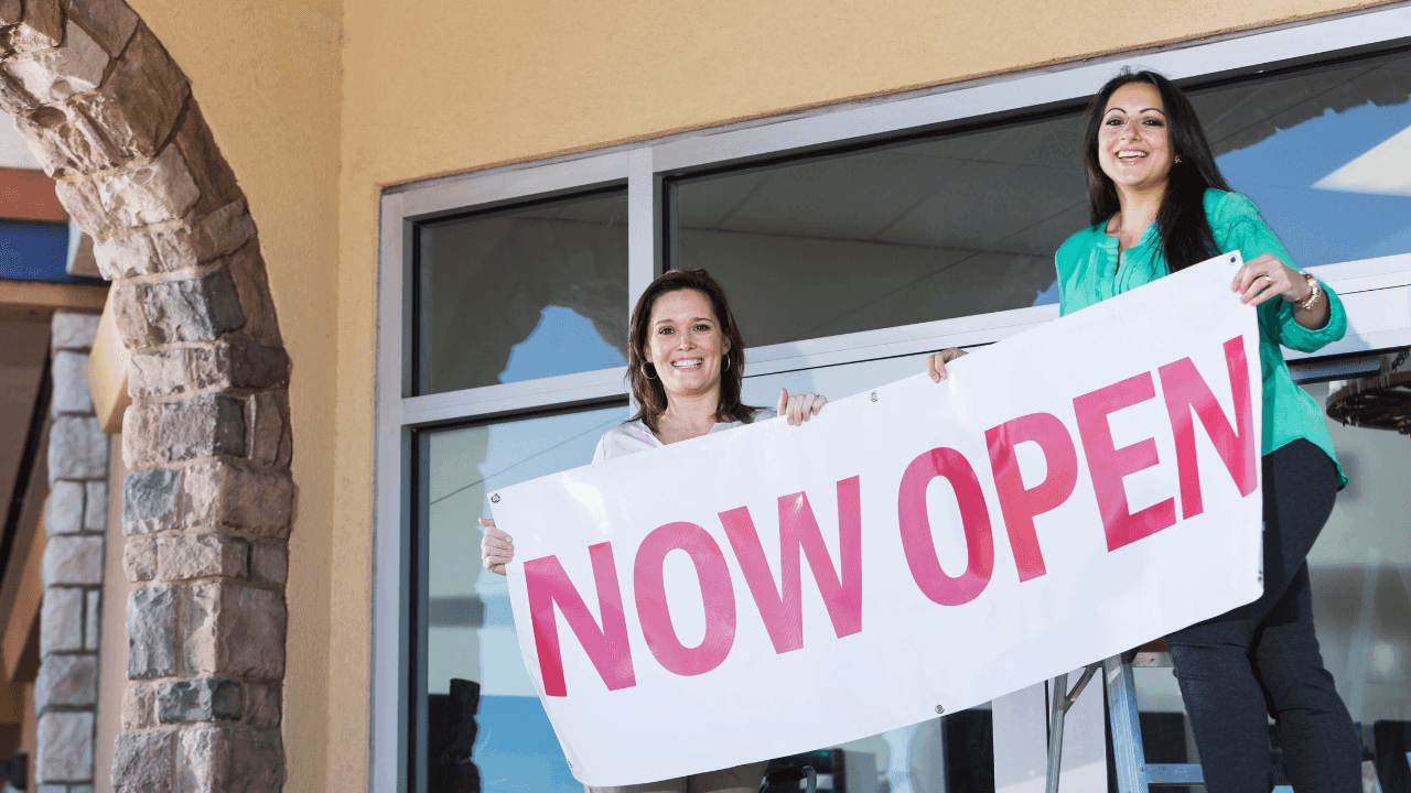 Two people at the grand opening of a new store